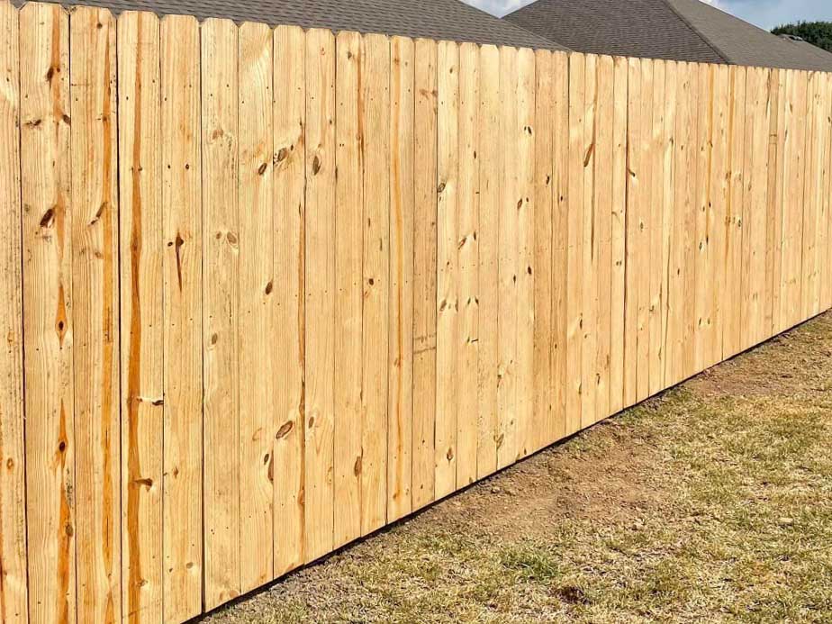 Branch LA stockade style wood fence
